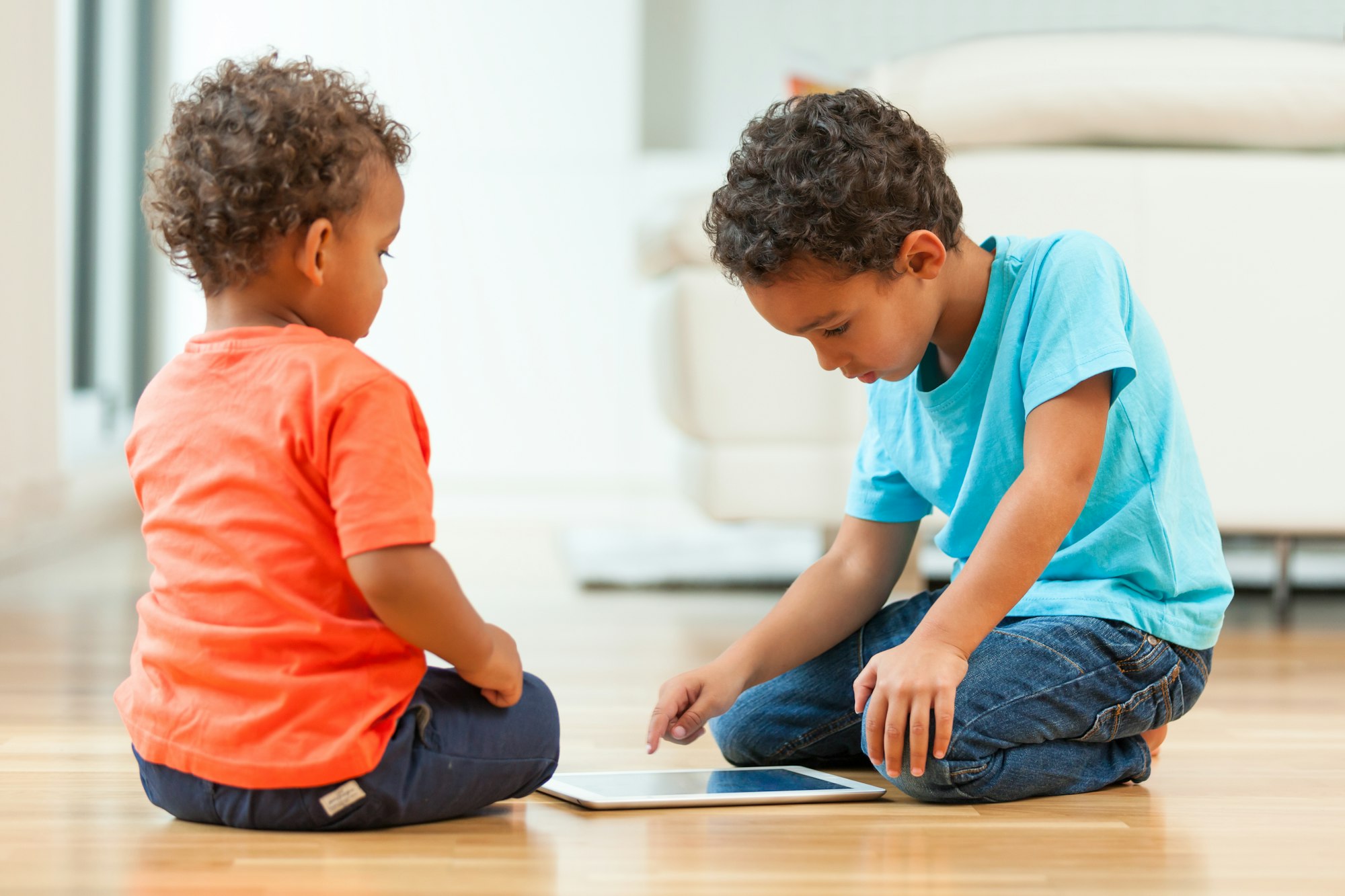 African american childrens using a tactile tablet