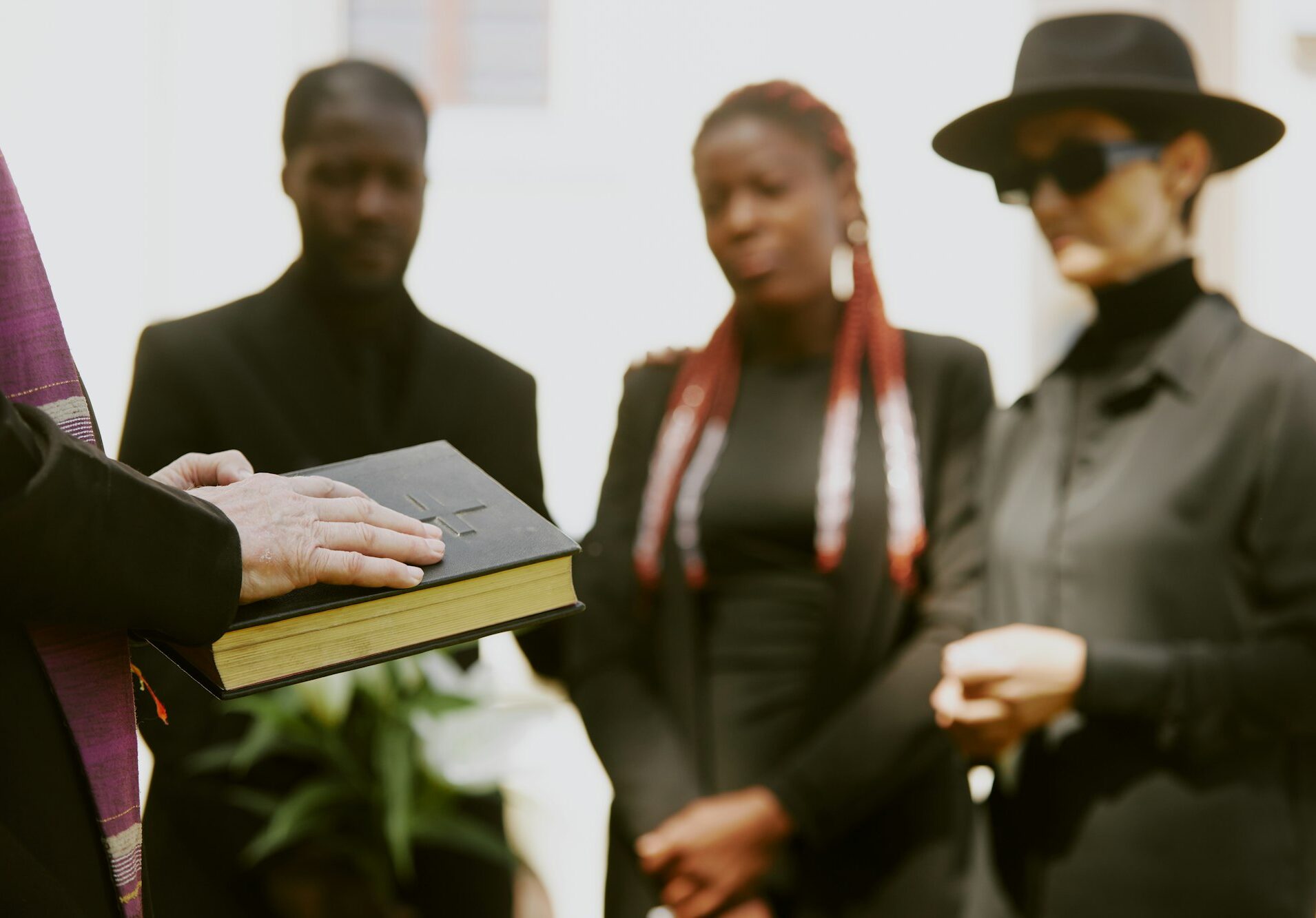 Pastor Holding Black Leather Bible