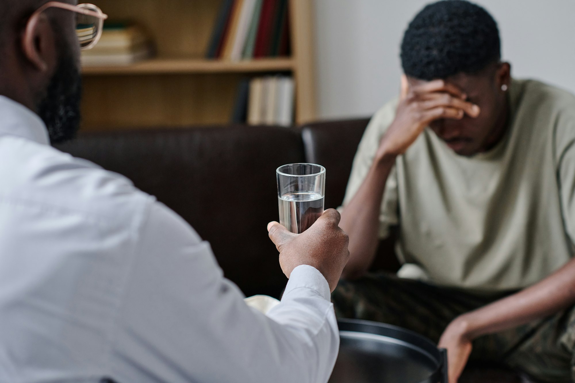 Psychotherapist supporting patient at office